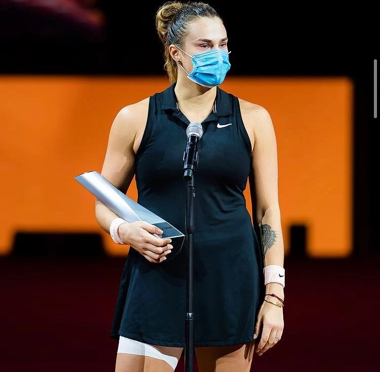 Aryna Sabalenka posing with trophy