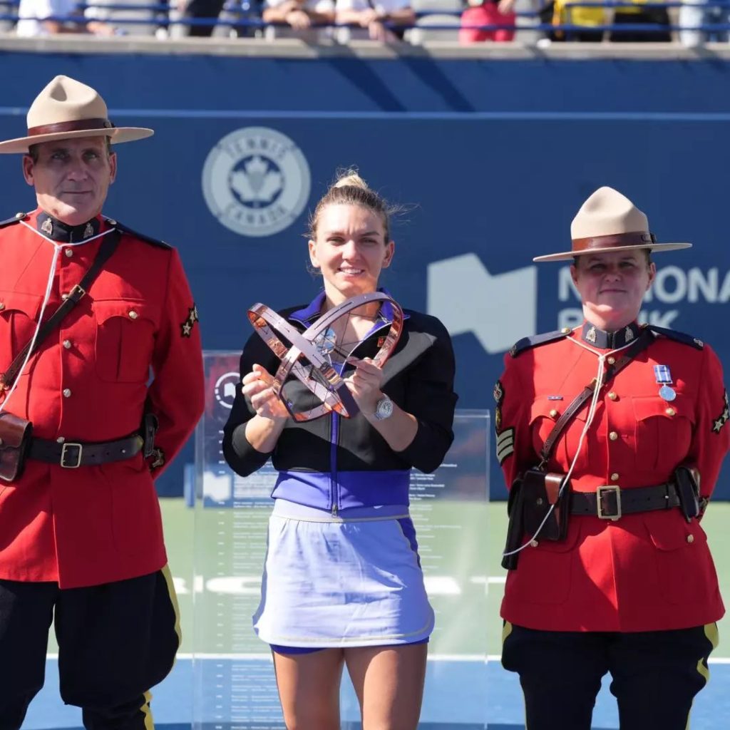 Simona Halep posing with National Bank Open 2022 Singles Final Trophy
