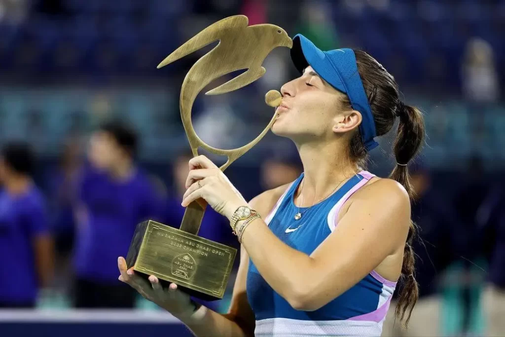 Belinda Bencic posing with Abu Dhabi Open Trophy